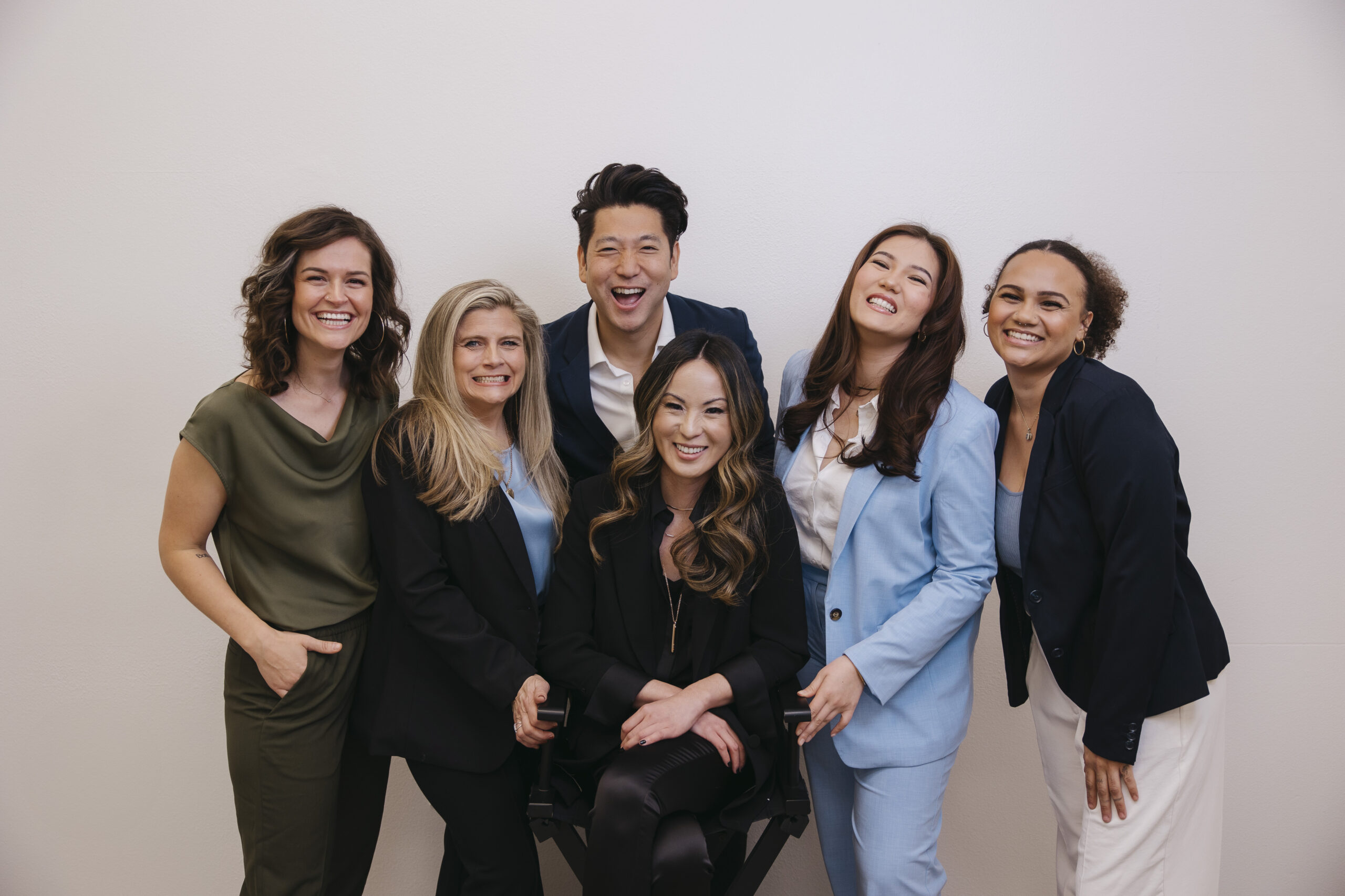 A professional group portrait of the Atlas Project leadership team in Las Vegas, representing nonprofit leadership, growth, and community impact.